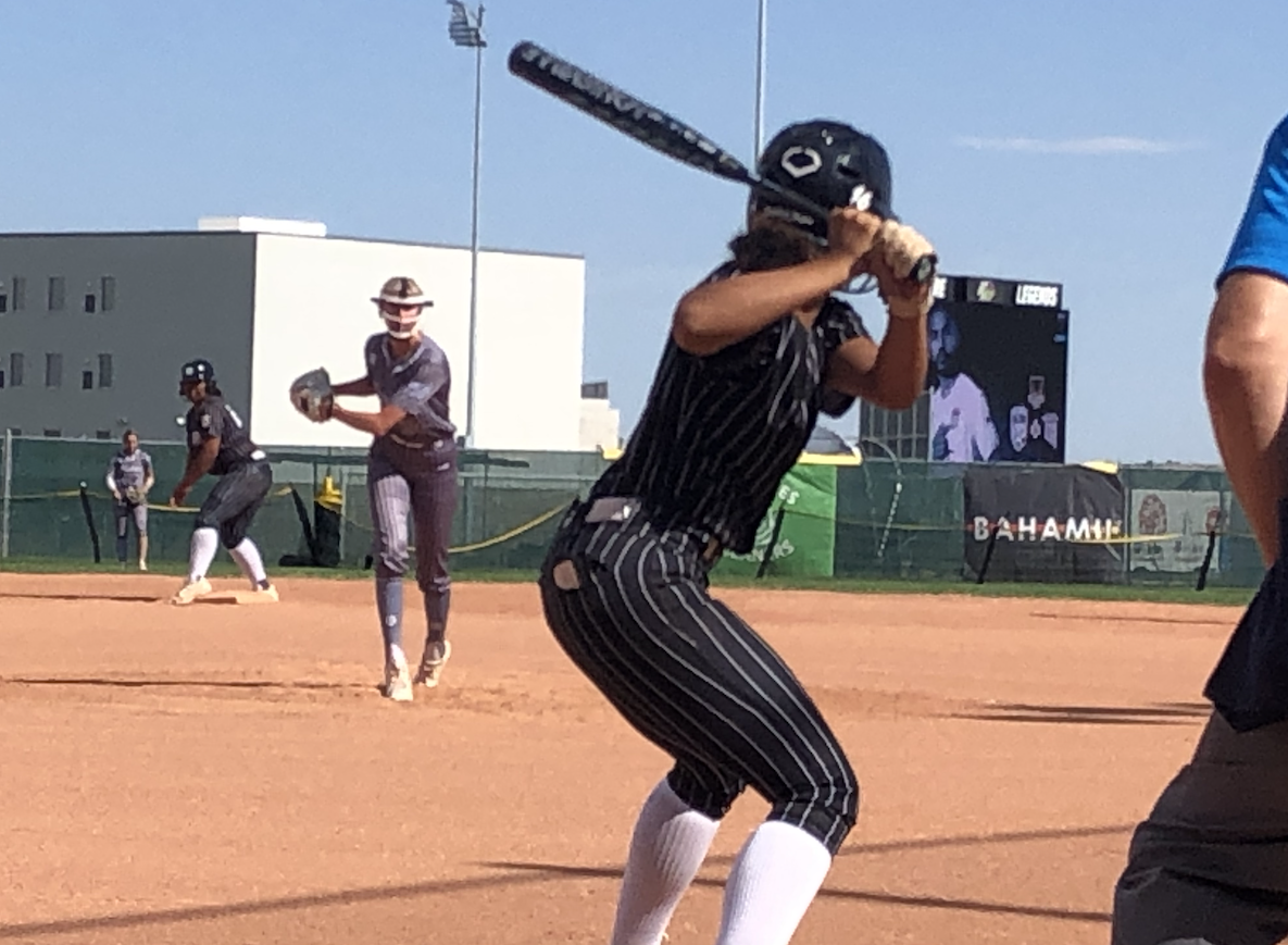Ki’ele Ho-Ching waits on the pitch she would hit for a grand slame to propel her Athletics - Tidd team to the Patriot Games 18U title