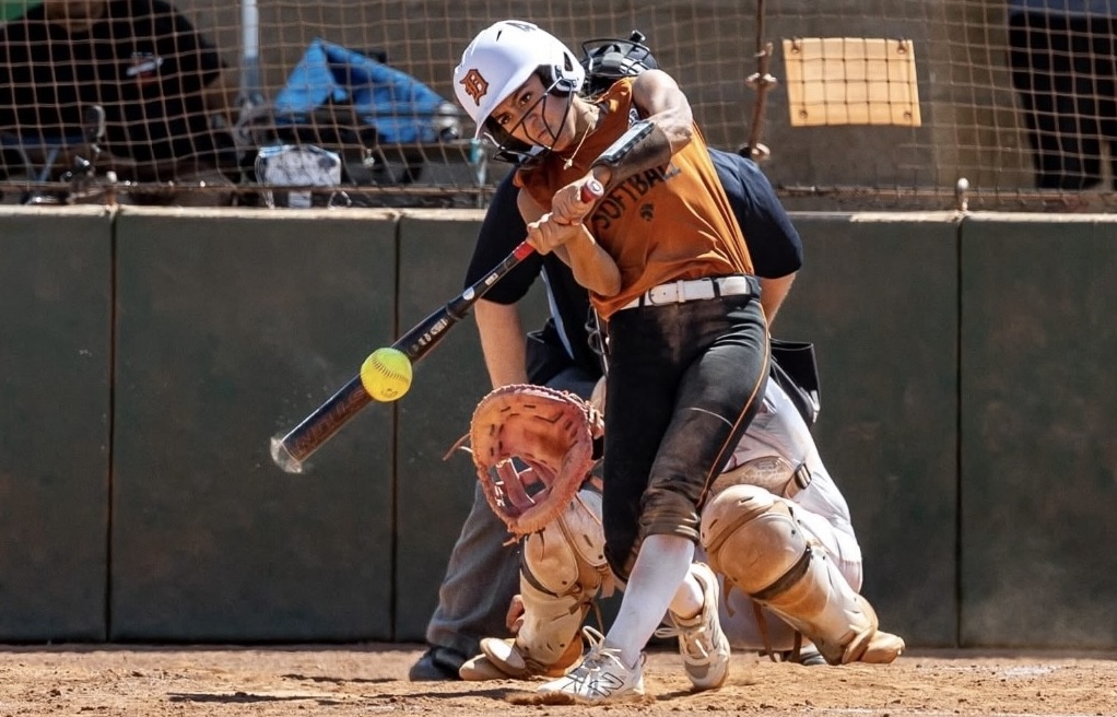 ACTION - 58 - Infielder Alexis Ruvalcaba of the Dirtdogs Gold 18U team coached by Marco Vazquez shows the focus that heped her bat .636 this year