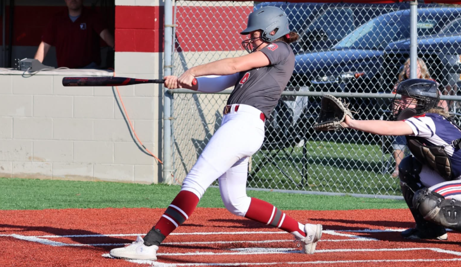 ACTION - Ohio State-bound senior Jenna Molk of Indiana Magic Gold - Bennett:Goddard is a tremendous two-way player with a strong pitching arm and dangerous bat